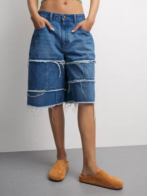 The FIX Women's Medium Wash Frayed Bermuda Denim Shorts